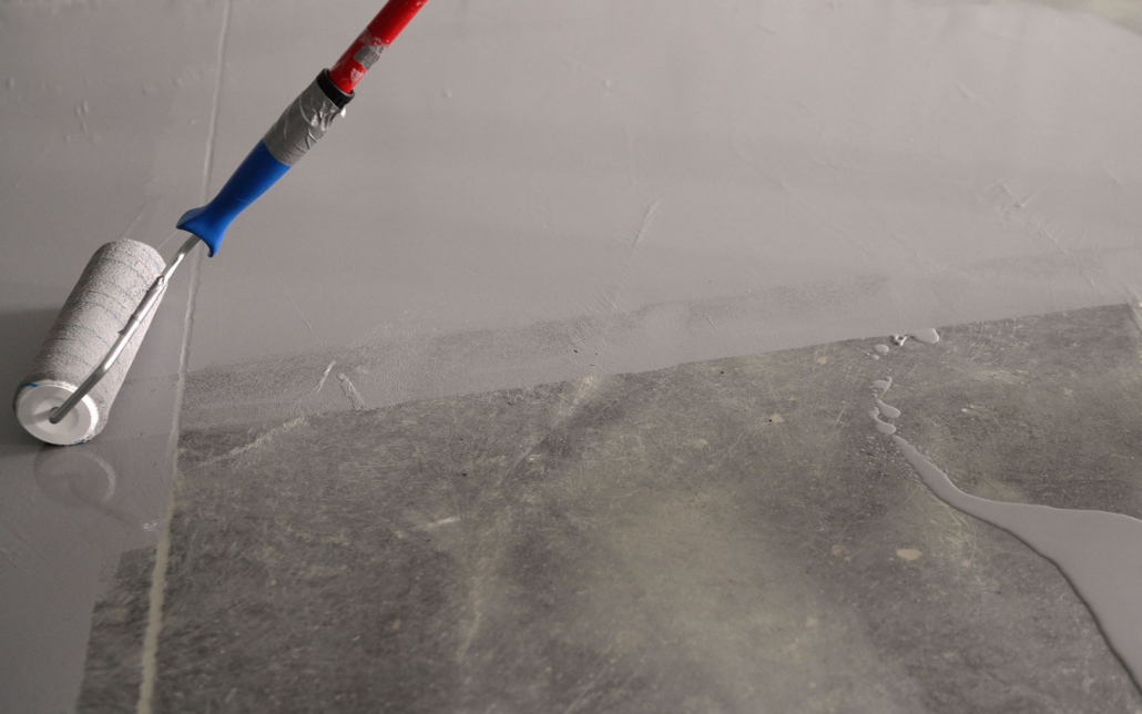 Close Up Of A Basement Floor Being Sealed