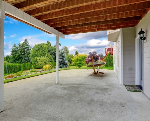 View Of A Concrete Patio On Back Of Home