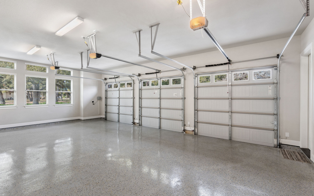 View of a large garage with epoxy floor View Of A Large Garage With Epoxy Floor